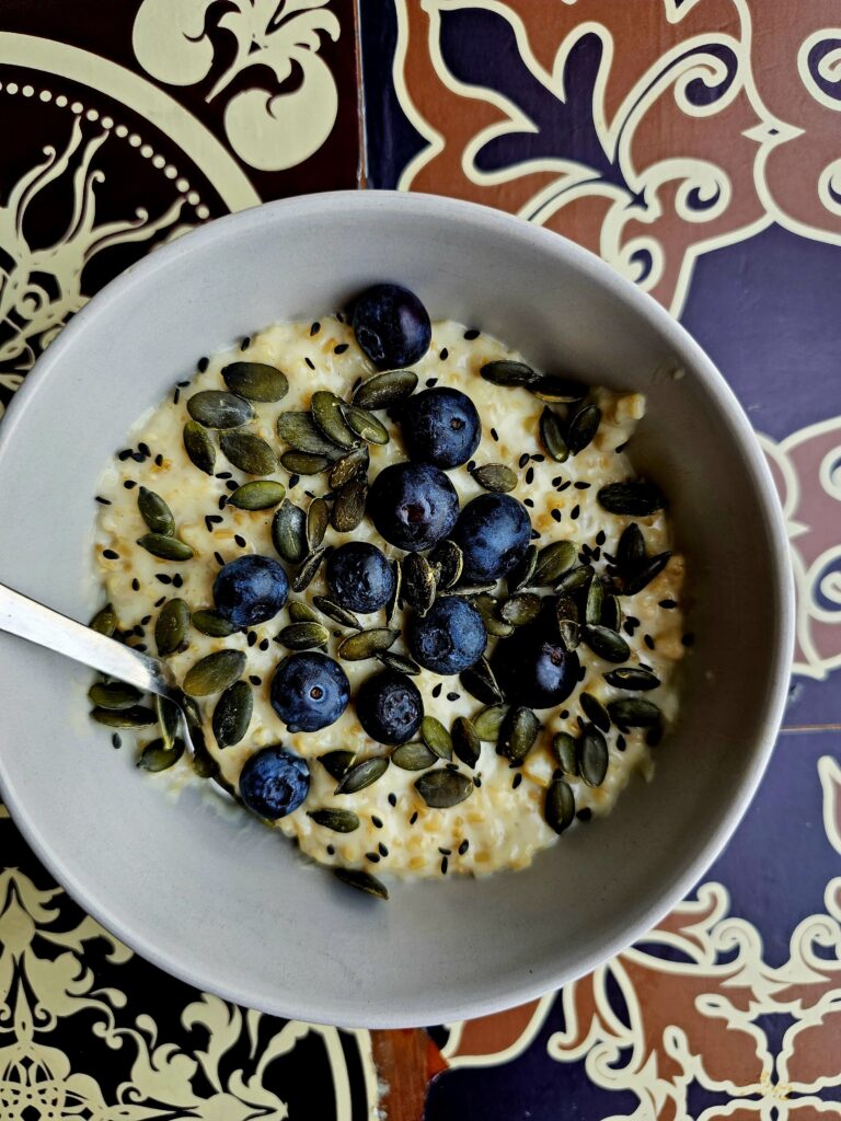 Oats porridge garnished with pumpkin seeds